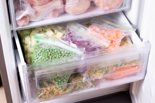 Home assortment of frozen vegetables in home fridge. frozen food in the freezer